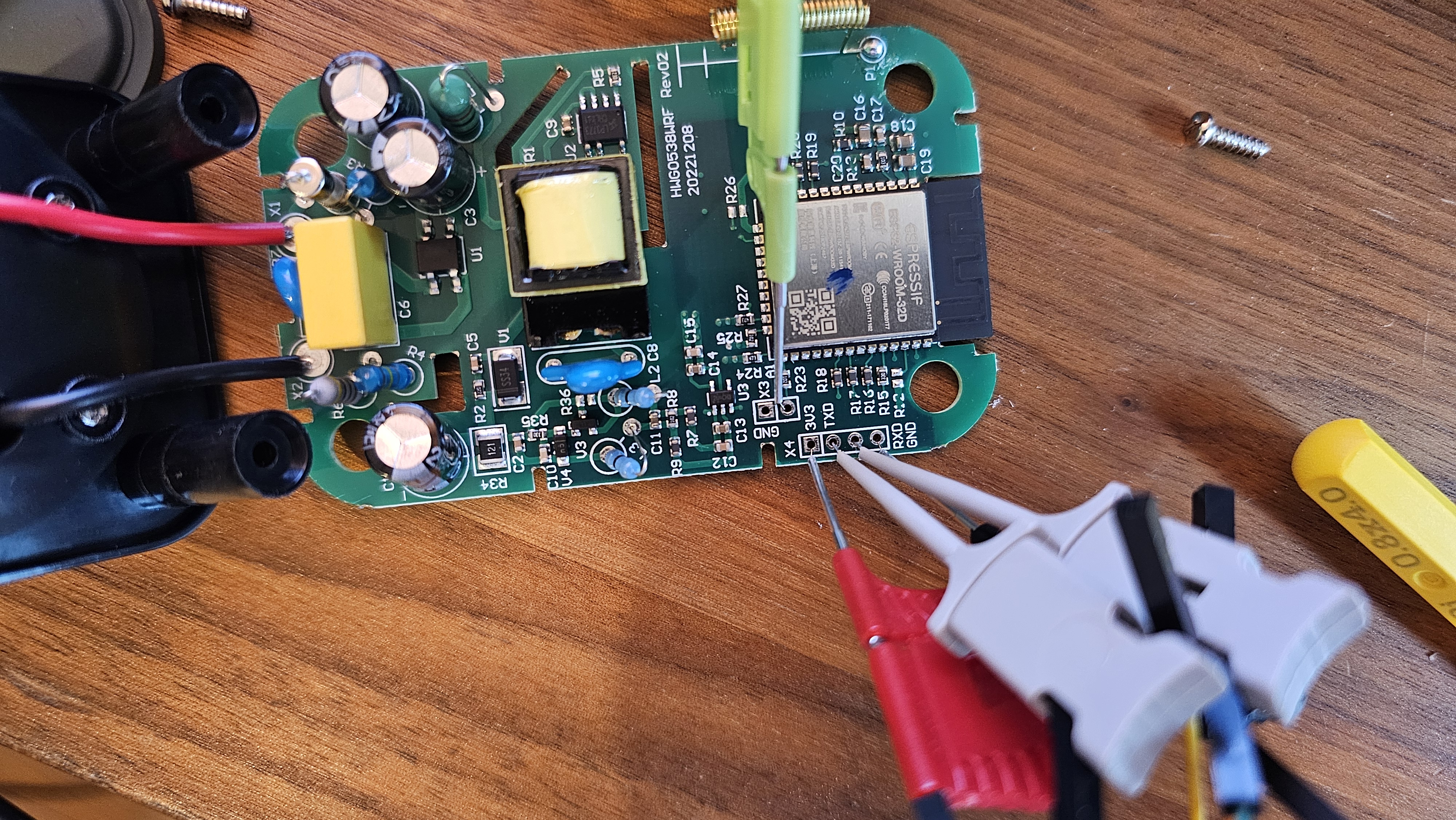 Opened DIIVOO gateway PCB with test clips connected to the ESP32 serial header.